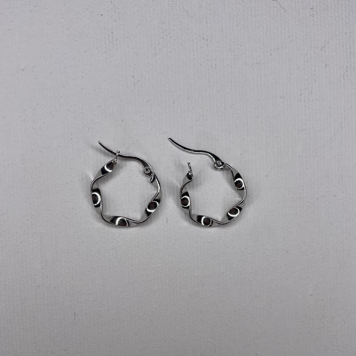 curved steel earrings