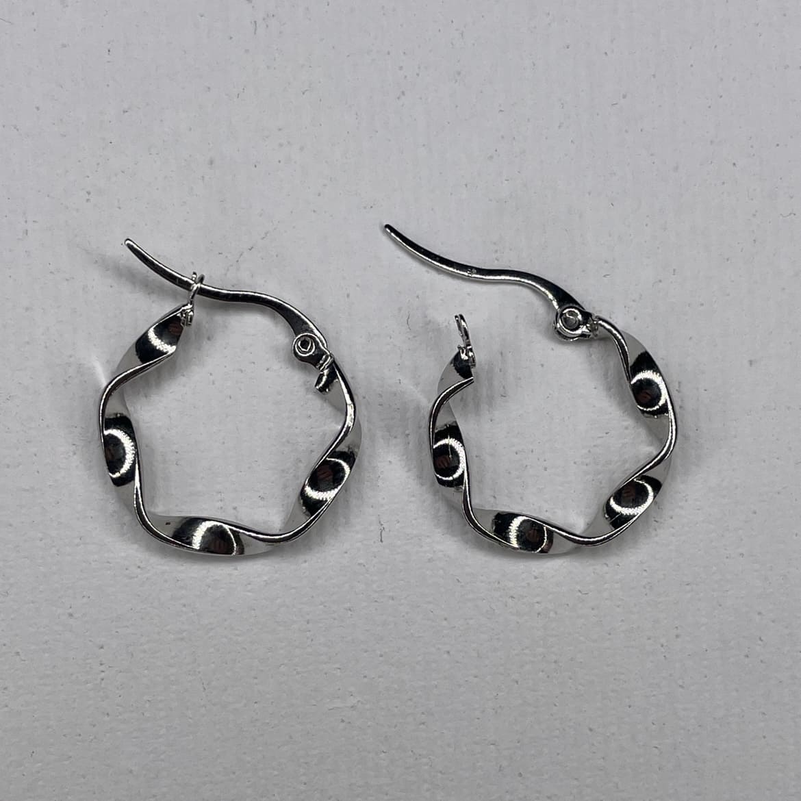 curved steel earrings