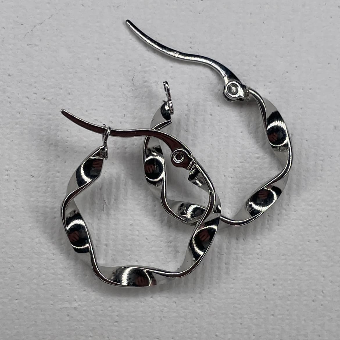 curved steel earrings